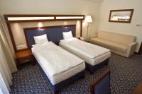 Posteľ alebo postele v izbe v ubytovaní Centrum Hotel