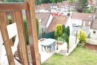 a view from the balcony of a house with a table at Gite Louvre Opale in Desvres