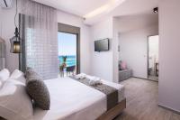 Posteľ alebo postele v izbe v ubytovaní Stelakis Beach