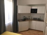 Kuchyňa alebo kuchynka v ubytovaní Apartamenty Mikubo Wrocław