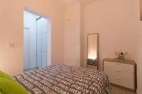 Postel nebo postele na pokoji v ubytování COQUETO APARTAMENTO EN EL CENTRO DE CADIZ