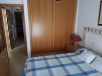 A bed or beds in a room at Apartamento A Peregrina (Silgar, Sanxenxo)