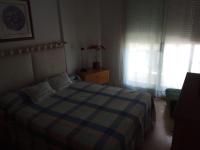 A bed or beds in a room at Apartamento A Peregrina (Silgar, Sanxenxo)