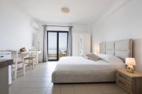 Posteľ alebo postele v izbe v ubytovaní Kimata Apartments