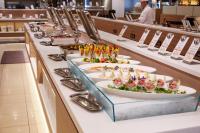 a buffet line with plates of food on it at Hotel Green Plaza Hakone in Hakone