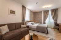 a living room with a bed and a couch at Residence Stine in Split
