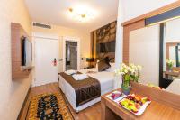 Postel nebo postele na pokoji v ubytování Eastanbul Suites