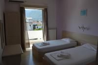Posteľ alebo postele v izbe v ubytovaní Dimitropoulos Apartments