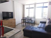 A television and/or entertainment centre at Apartaments Vacations Playa del Ingles