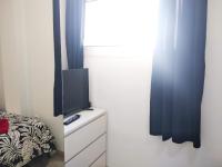 A television and/or entertainment centre at Apartaments Vacations Playa del Ingles