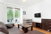 TV a/nebo společenská místnost v ubytování Jantar Apartamenty - Family Vacation Polanki