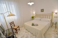 Posteľ alebo postele v izbe v ubytovaní La Kenzia Casa Vacanze