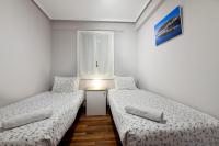 Posteľ alebo postele v izbe v ubytovaní City Beach Living