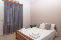 Cama ou camas em um quarto em Naxos Asty