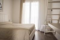 Posteľ alebo postele v izbe v ubytovaní Home Suites Home