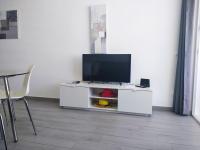 A television and/or entertainment centre at Apartaments Vacations Playa del Ingles