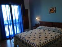 Posteľ alebo postele v izbe v ubytovaní Hotel Pina Ristorante