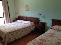 Posteľ alebo postele v izbe v ubytovaní Hotel Pina Ristorante
