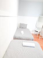 Posteľ alebo postele v izbe v ubytovaní Pension Aussie Guesthouse