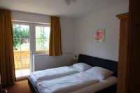 Łóżko lub łóżka w pokoju w obiekcie Haus Elisengrund am Geigenbuehel - chalet privé