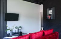 TV a/nebo společenská místnost v ubytování Apartament Berg
