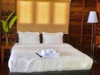 Postel nebo postele na pokoji v ubytování Itsara bungalow