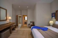 A bed or beds in a room at Minaret Suites and Apartments