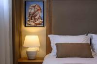 A bed or beds in a room at Minaret Suites and Apartments