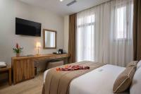 A bed or beds in a room at Minaret Suites and Apartments