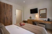 A bed or beds in a room at Minaret Suites and Apartments