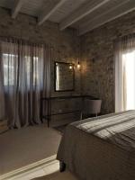 Postel nebo postele na pokoji v ubytování Casa Della Vita Gouves Cretan Luxury Villa