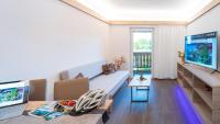 Televízia a/alebo spoločenská miestnosť v ubytovaní Apartments Presslauer - Mori