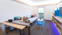 Televízia a/alebo spoločenská miestnosť v ubytovaní Apartments Presslauer - Mori