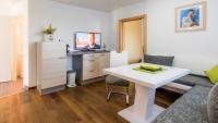 Televízia a/alebo spoločenská miestnosť v ubytovaní Apartments Presslauer - Mori
