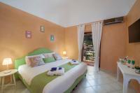 A bed or beds in a room at Villa Eos