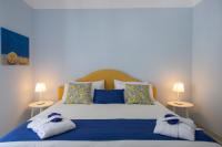 A bed or beds in a room at Villa Eos