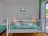 Łóżko lub łóżka w pokoju w obiekcie Apartments Folo