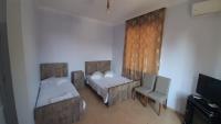 Ein Bett oder Betten in einem Zimmer der Unterkunft Hotel Evrazia