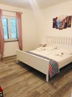 Posteľ alebo postele v izbe v ubytovaní Apartments Biba