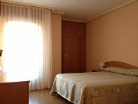 Postel nebo postele na pokoji v ubytování Apartamentos Turisticos Puerta de León