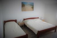 Posteľ alebo postele v izbe v ubytovaní Apartment Donat