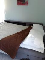 Łóżko lub łóżka w pokoju w obiekcie Marianos Apartments