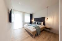 Posteľ alebo postele v izbe v ubytovaní SOFTALPIN Garden Suites