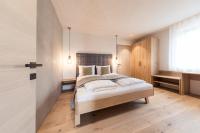 Posteľ alebo postele v izbe v ubytovaní SOFTALPIN Garden Suites