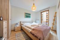 Posteľ alebo postele v izbe v ubytovaní Apartamenty Sun & Snow Rezydencja Park