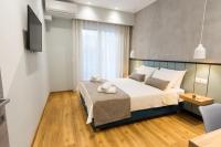 Posteľ alebo postele v izbe v ubytovaní Pleasant Stay