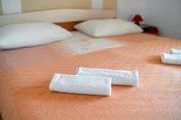 Postel nebo postele na pokoji v ubytování Apartments Janjac