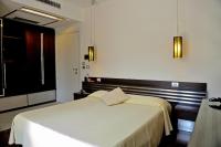 Łóżko lub łóżka w pokoju w obiekcie Hotel Le Piane