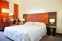Posteľ alebo postele v izbe v ubytovaní Mercure Reggio Emilia Centro Astoria