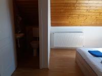 Łóżko lub łóżka w pokoju w obiekcie Major apartman